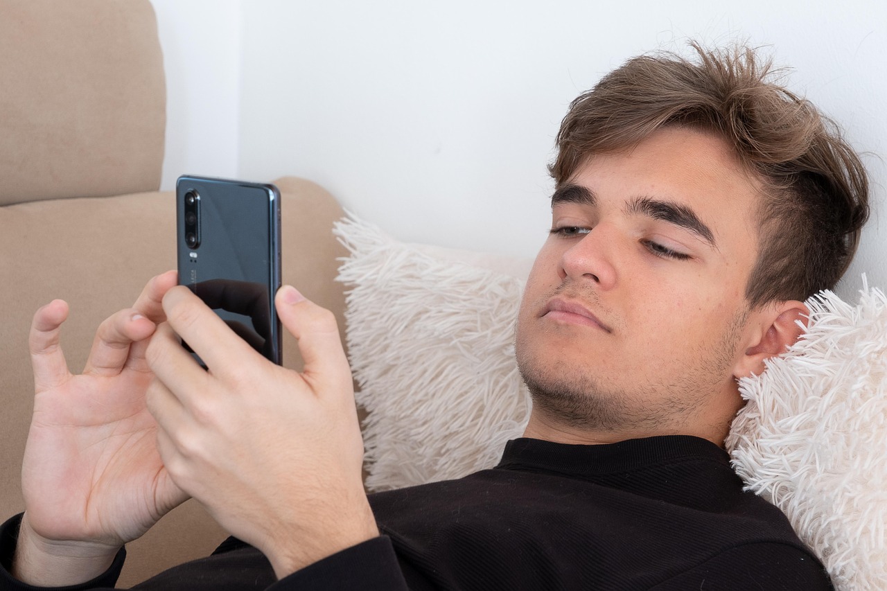 teenager, sofa, smartphone, man, mobile phone, relaxing, caucasian